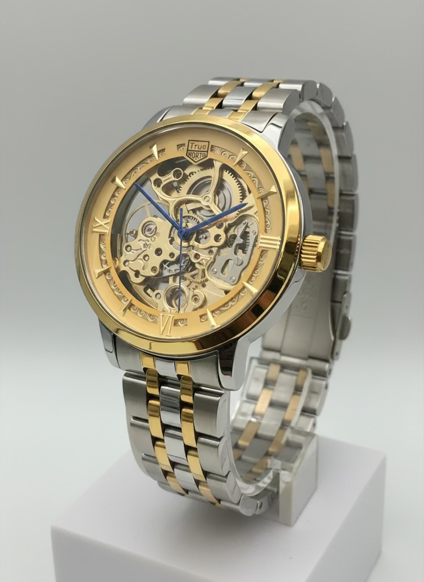 Gold and silver watch on a stand with a blurred background